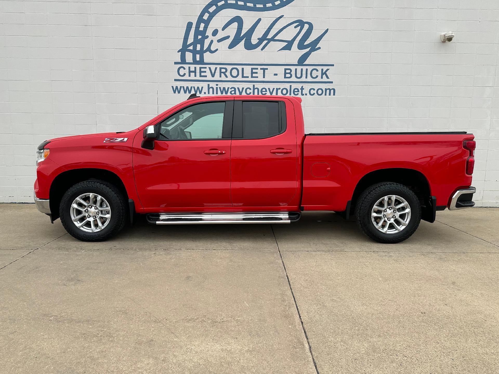 2024 Chevrolet Silverado 1500 LT in Red Hot — front three-quarter view