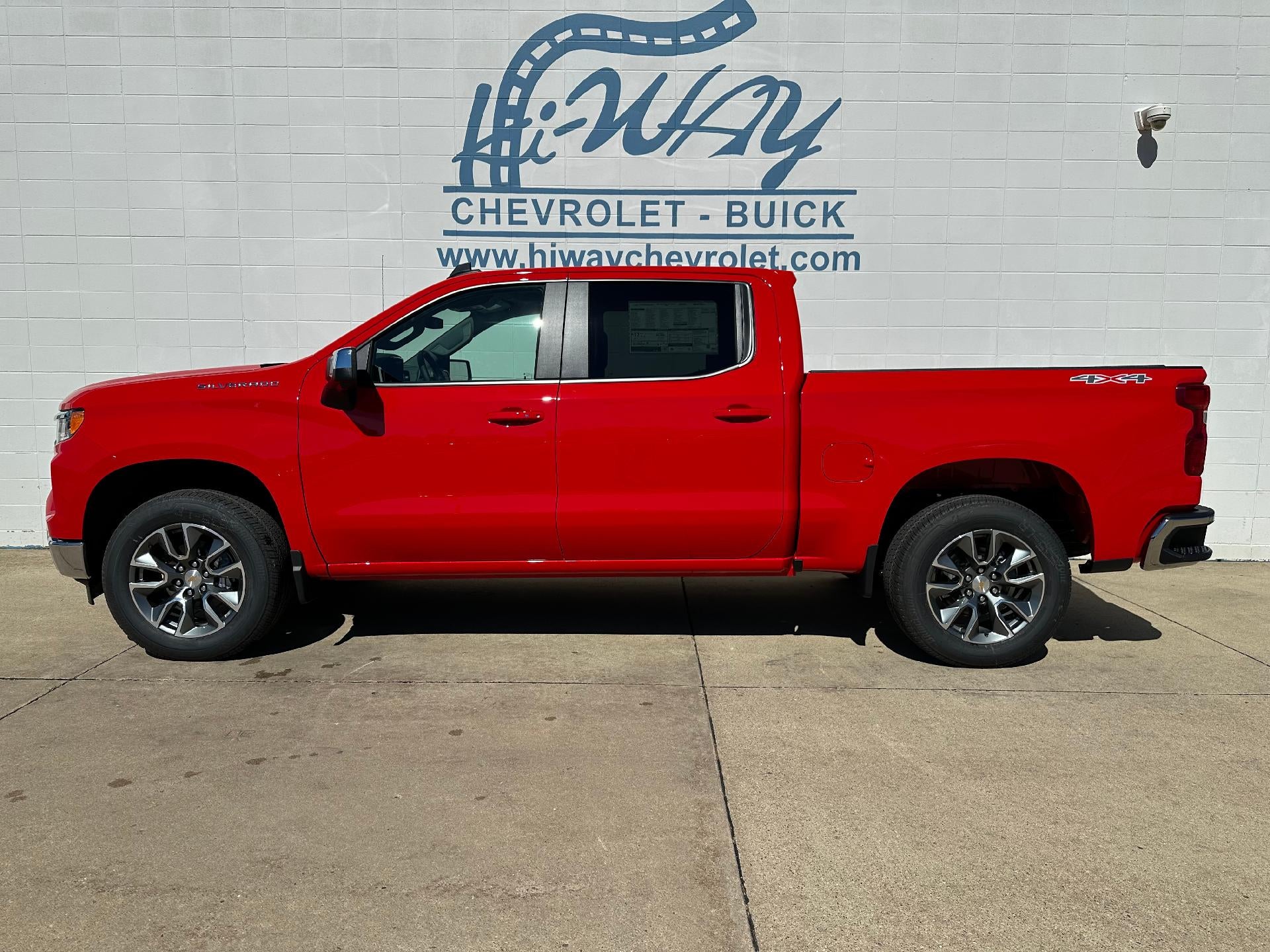 2026 Chevrolet Silverado 1500 LT in Red Hot — front three-quarter view