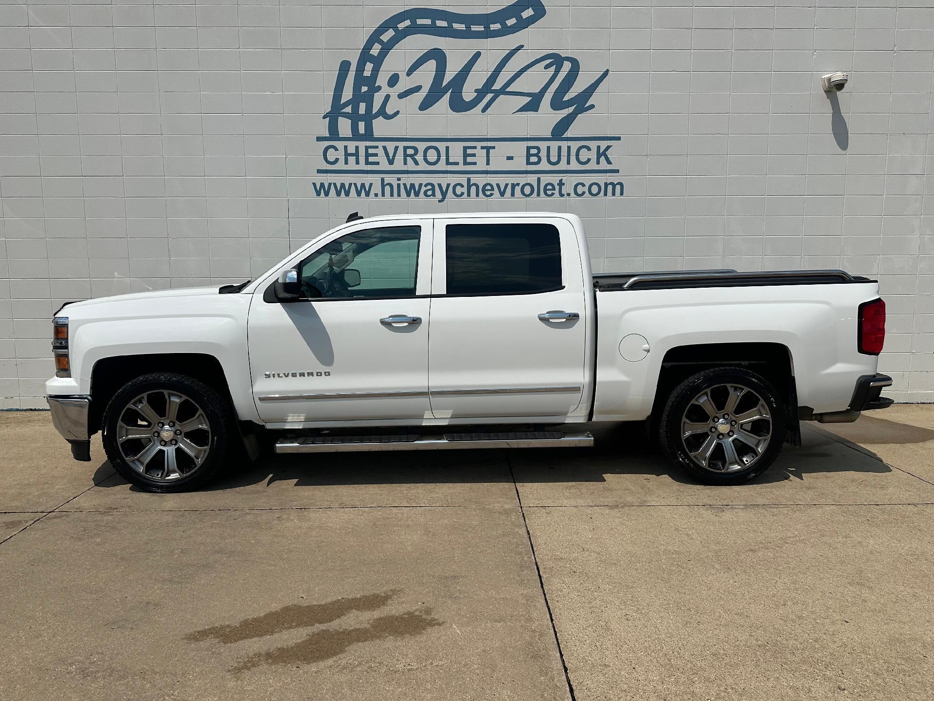 2014 Chevrolet Silverado 1500 LTZ in Summit White — front three-quarter view