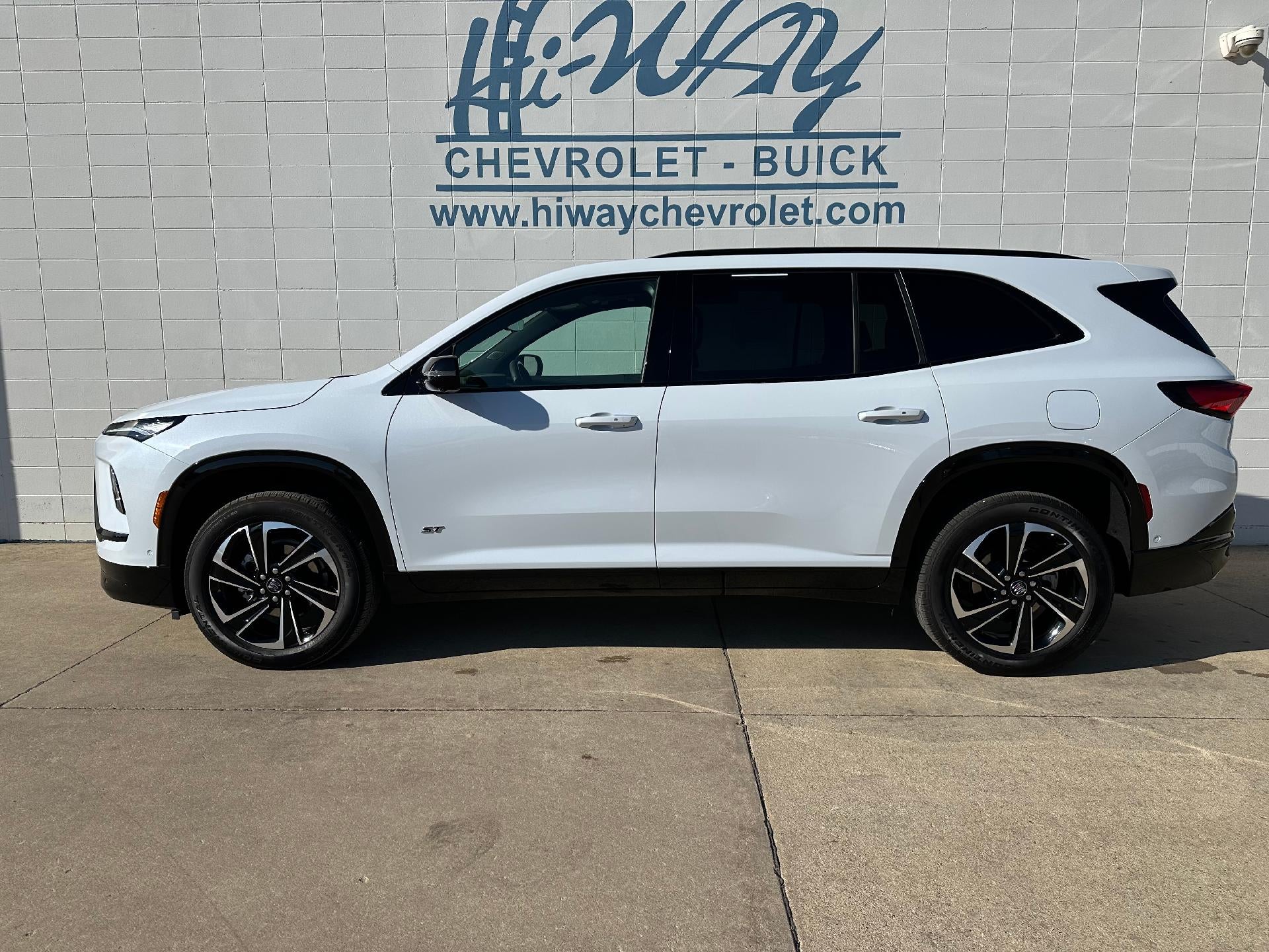 2026 Buick Enclave Sport Touring in Iridescent White Tricoat — front three-quarter view