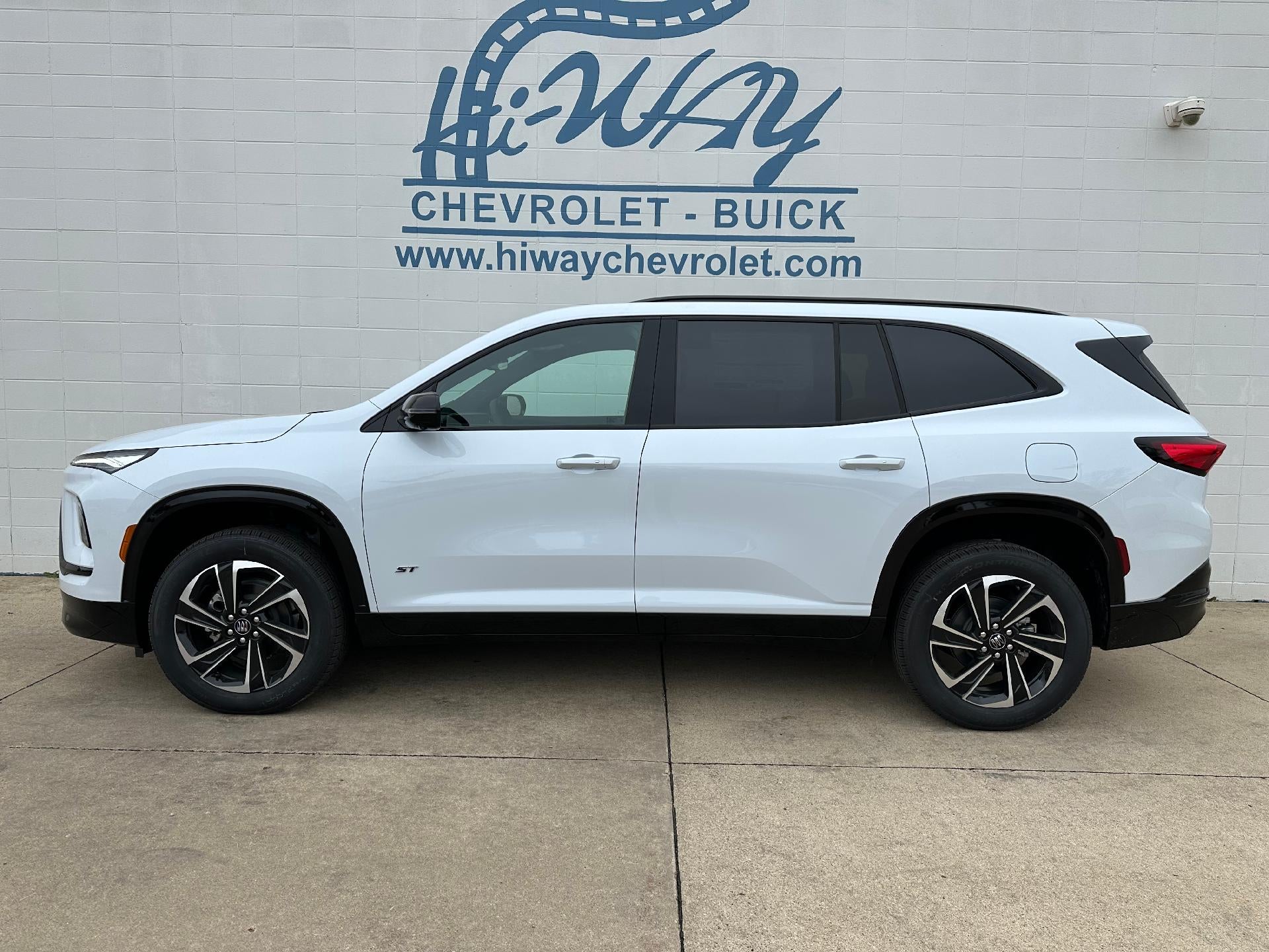 2026 Buick Enclave Sport Touring in Iridescent White Tricoat — front three-quarter view