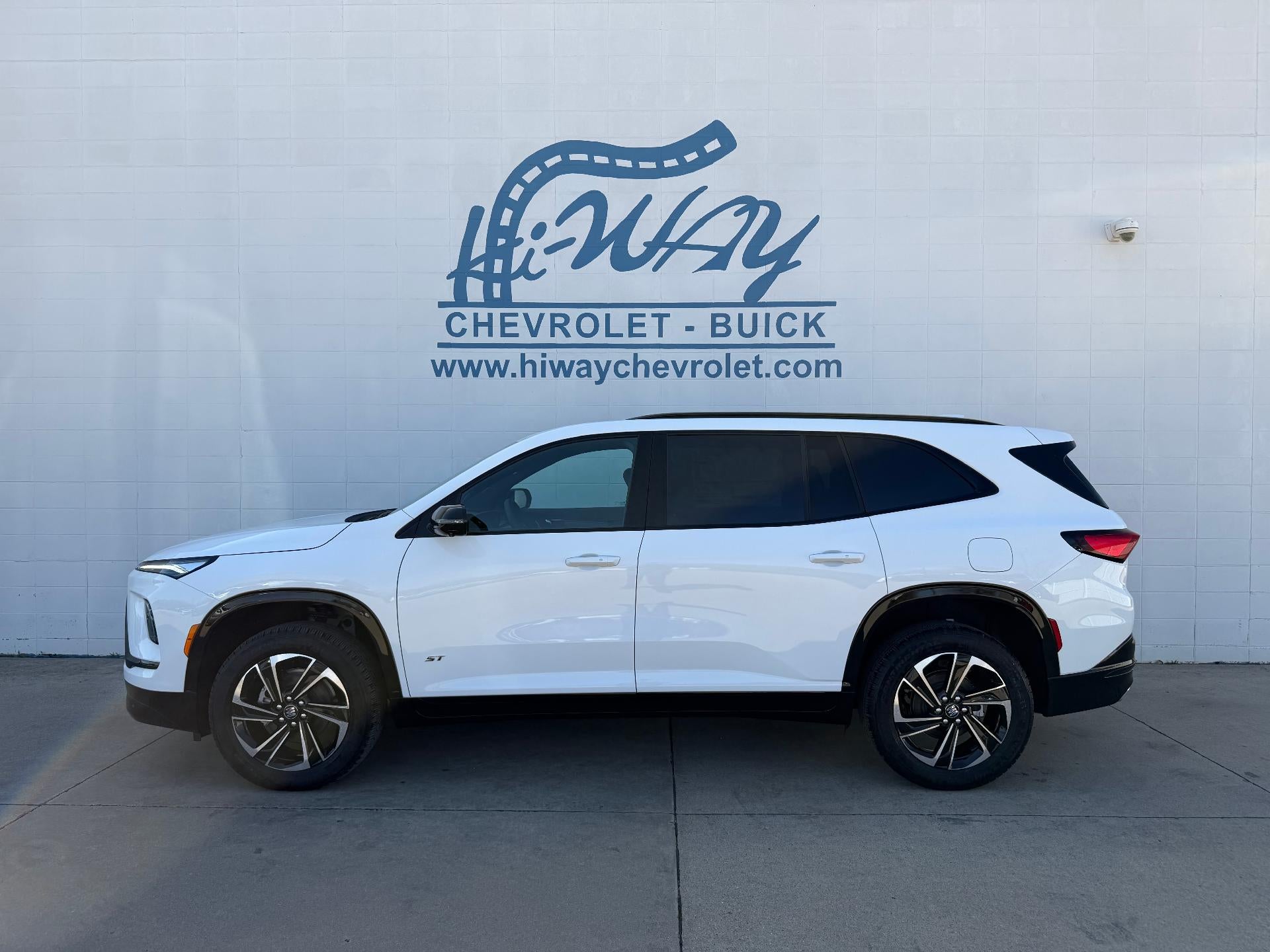 2026 Buick Enclave Sport Touring in Summit White — front three-quarter view