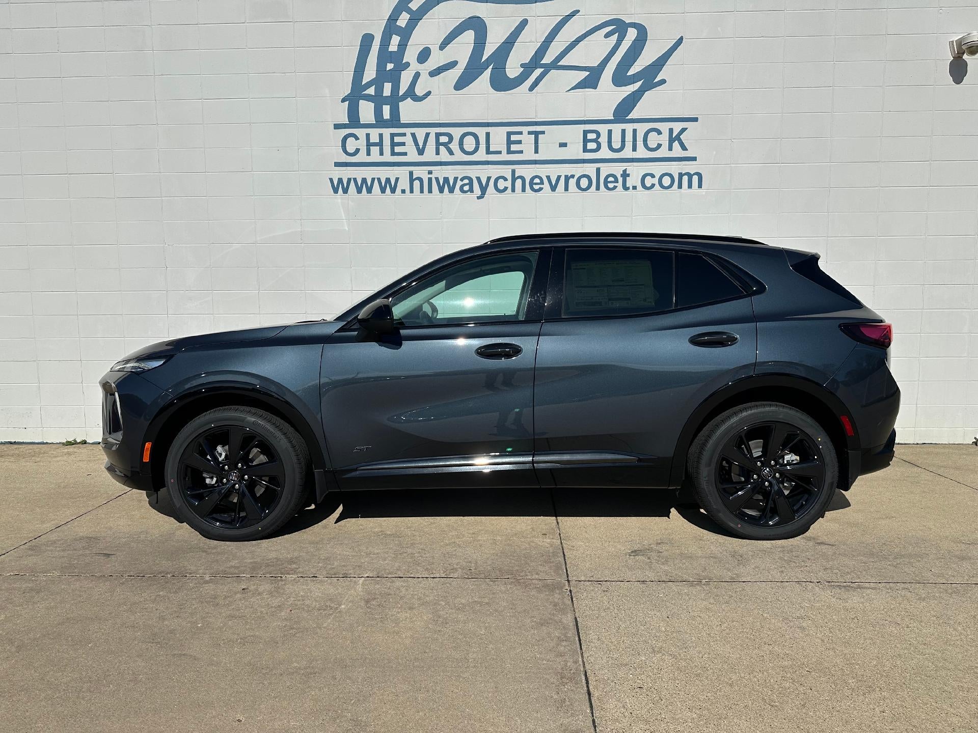 2026 Buick Envision Sport Touring in Quartz Blue Metallic — front three-quarter view